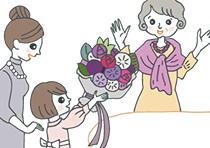 紫色の花束を贈られている古希祝いをされた女性